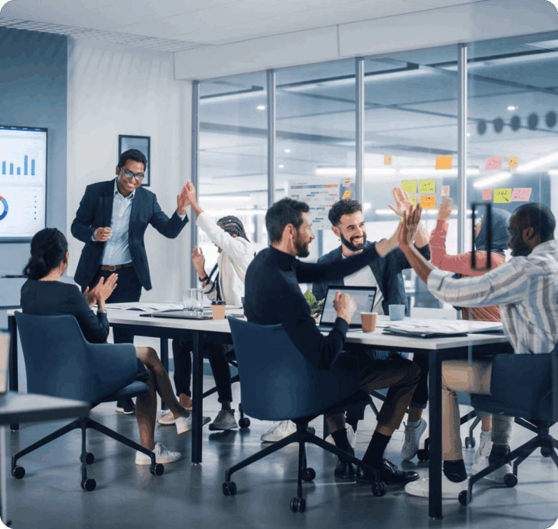 Office team applauding and celebrating success